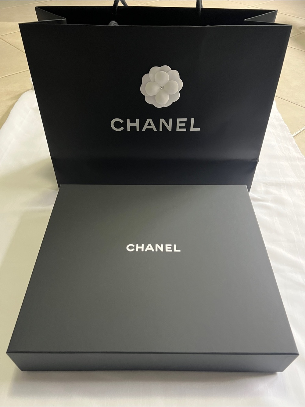 Chanel box and paper bag.